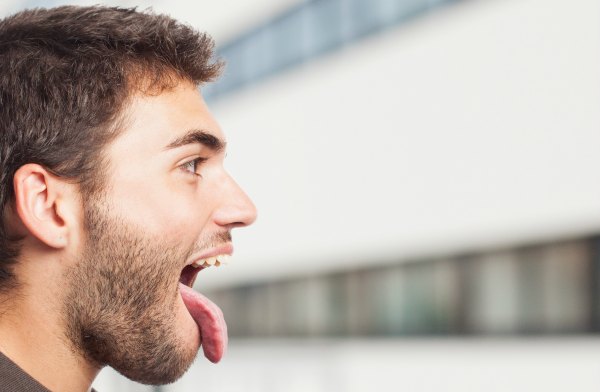 portrait of a handsome man kidding showing his tongue